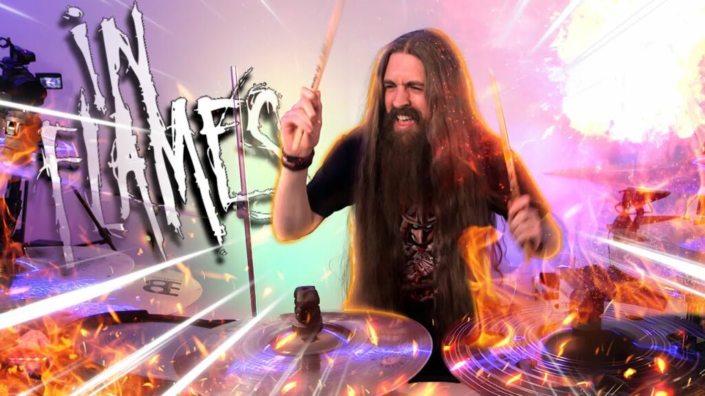 66Samus playing drums with big "In Flames" text behind him