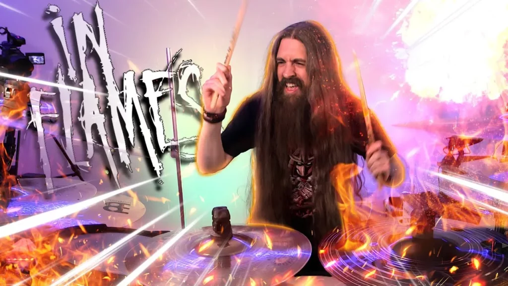 66samus playing drums with big "in flames" text behind him